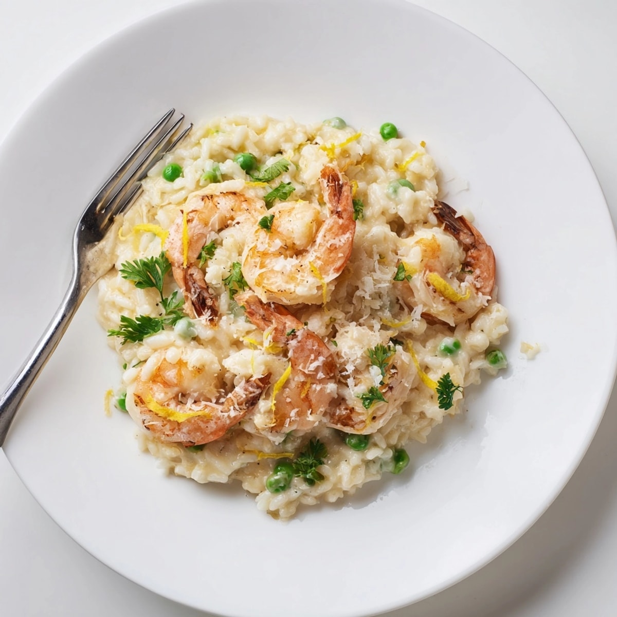 Close-up of a delicious Shrimp Parmesan Rice Skillet with melted cheese and parsley.