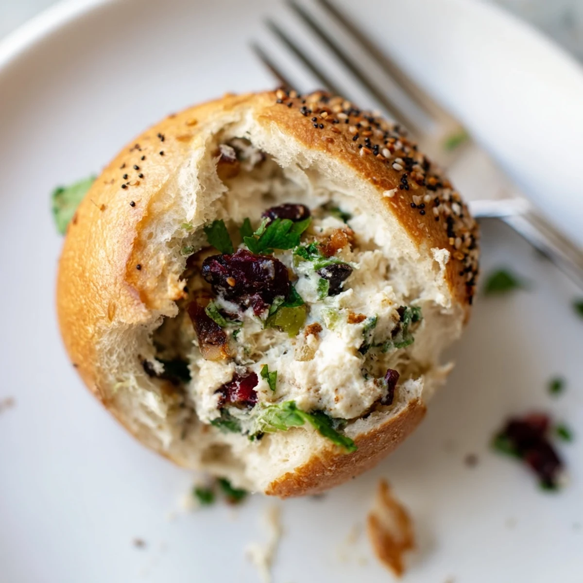 Soft bagel bombs filled with creamy cranberry jalapeño dip and topped perfectly.