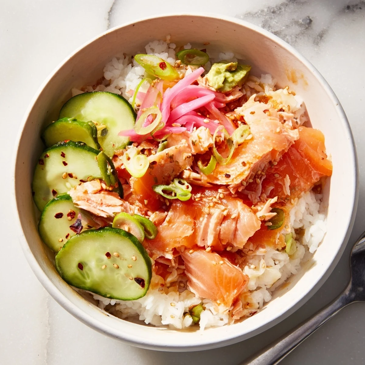 Quick and easy Leftover Salmon & Rice Bowl, vibrant flavors with sesame and soy drizzle.  