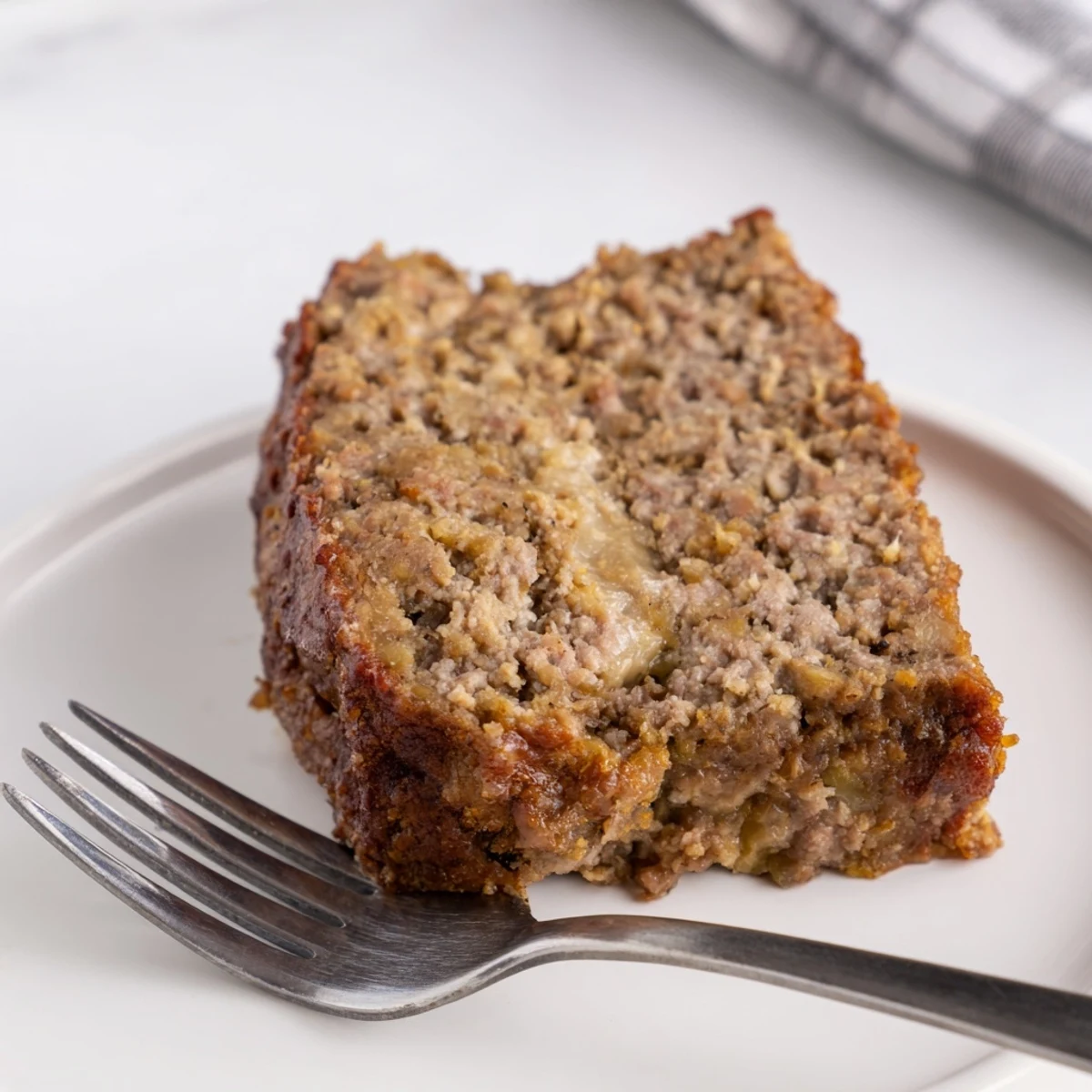 Warm, tender Effortless Stove Top Stuffing Meatloaf, perfect for a budget-friendly, weeknight dinner.