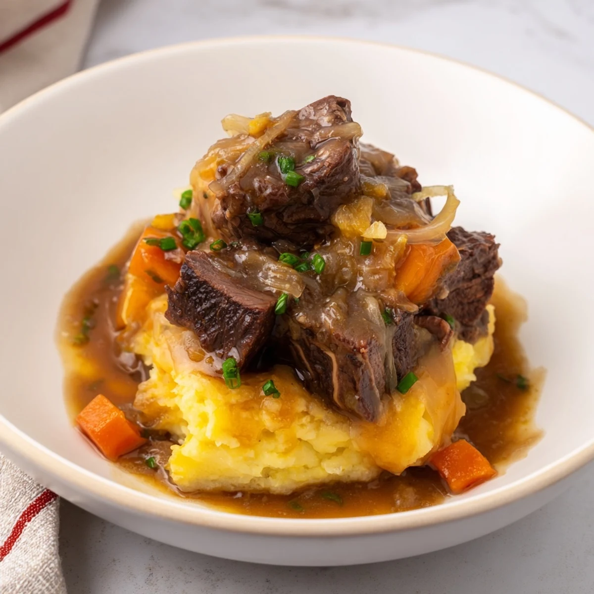Fall Apple Cider Stew Mash: Hearty beef stew piled over creamy cheddar mashed potatoes, a comforting dinner.