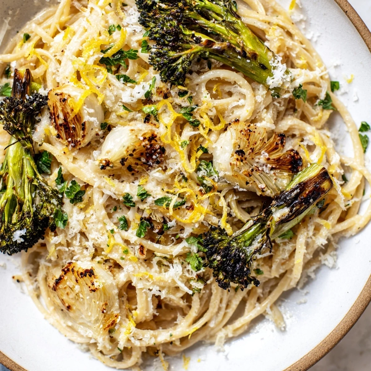 Bright, zesty Roasted Garlic Lemon Broccoli Angel Hair Pasta, tossed to perfection with lemon and cheese.