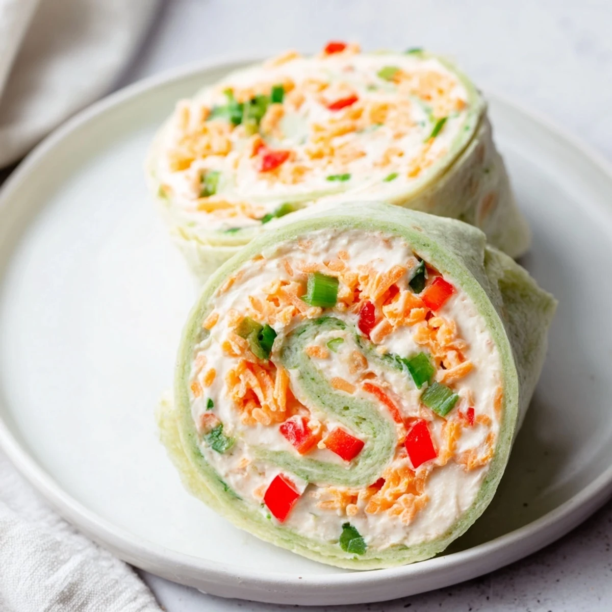 These delicious Cozy Scarf Holiday Pinwheel Wraps present a delightful mix of flavors and textures, perfect for sharing.