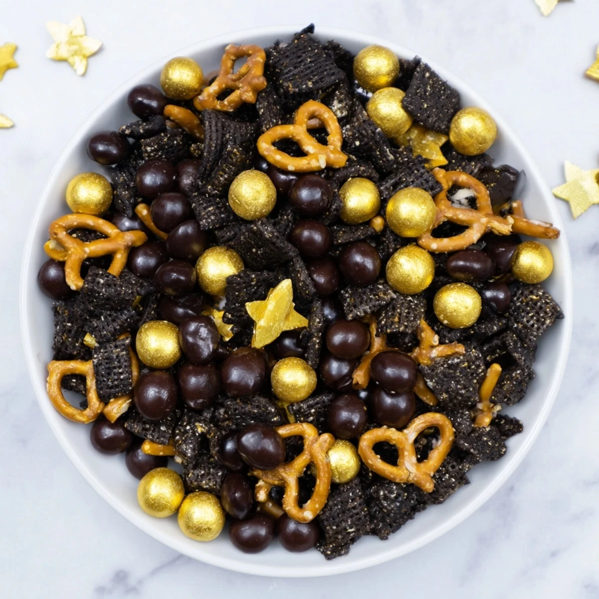Sweet and salty gourmet midnight snack mix with dark chocolate chips is ready to enjoy.