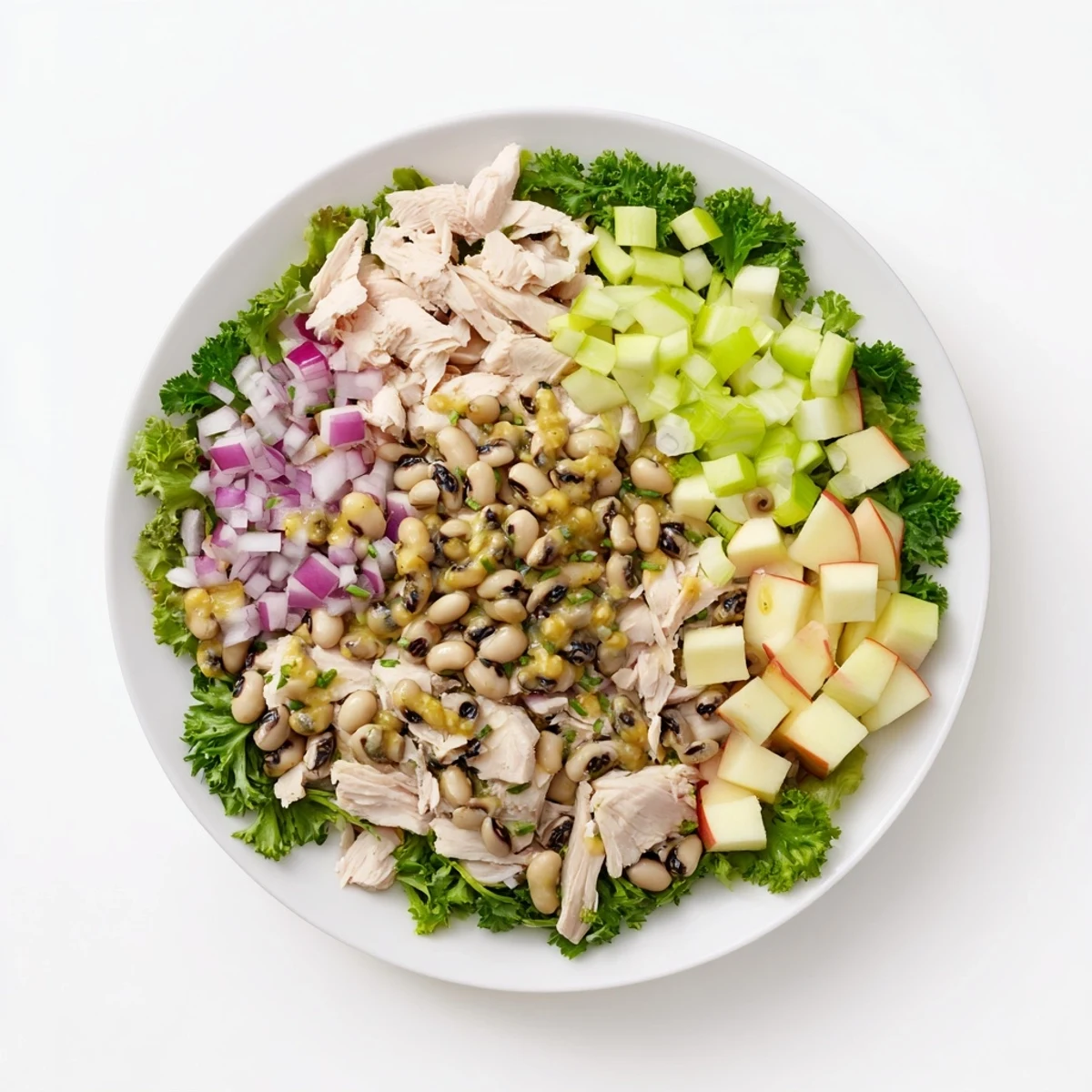 This delicious Chicken and Apple New Years Luck Salad features juicy chicken, fresh greens, and a flavorful honey-mustard dressing.