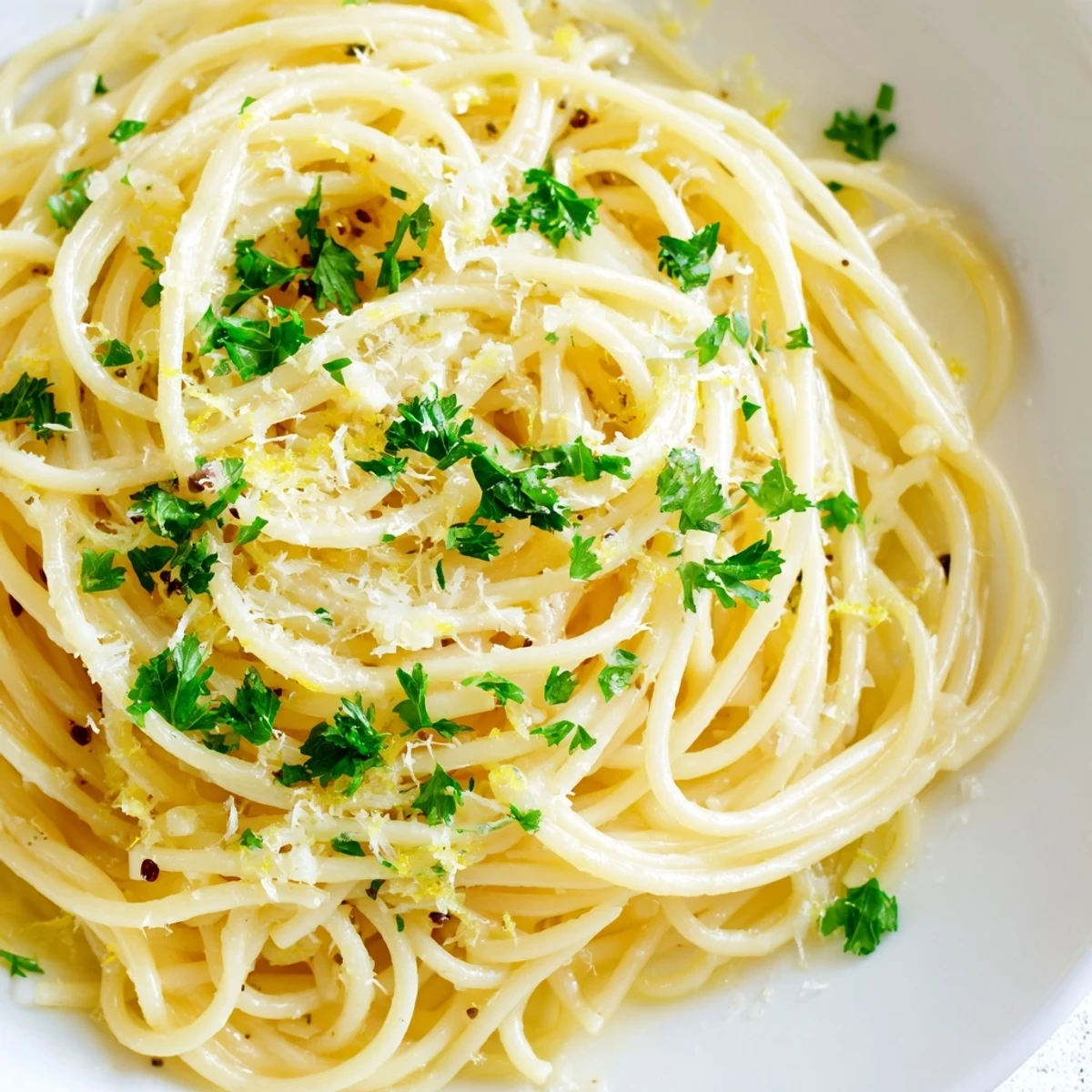 Steaming bowl of Garlic Butter Noodles, fragrant and glistening, ready for a comforting meal.