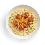 Golden, cheesy One-Pot Honey BBQ Chicken Mac and Cheese with a drizzle of sweet BBQ sauce.