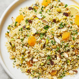 A vibrant, close-up of delicious couscous pilaf spiced, showcasing fluffy grains, and toasted nuts.