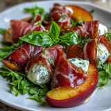 Vibrant summer salad featuring peach burrata prosciutto: sweet, salty, and creamy.