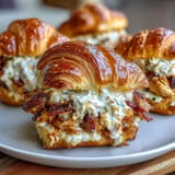 Fluffy croissant sliders piled high with chicken, bacon, and creamy ranch dressing.