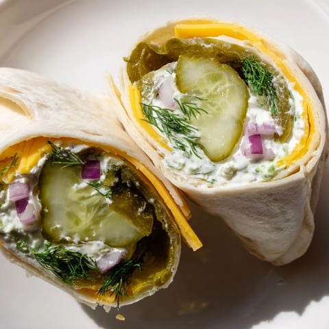Crisp and creamy Pickle-in-a-Blanket rolls, perfect for easy party snacks.  