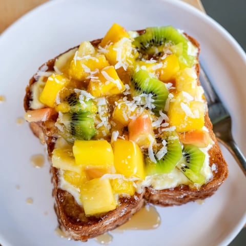 Creamy Yogurt-Custard Toast topped with fresh tropical fruit for a delightful breakfast.  