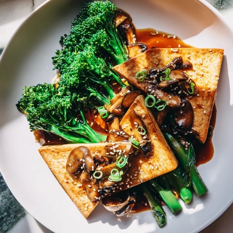 Golden-brown Sautéed Tofu Steak with Broccoli, a delicious vegan Asian-inspired meal, ready to serve.