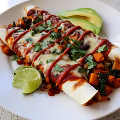 Warm, cheesy One-Pan Sweet Potato, Black Bean & Kale Enchiladas, baked to bubbly perfection right in the pan.