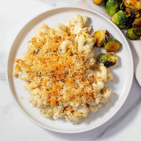 Sheet Pan Mac and Cheese with Brussels Sprouts, cheesy and golden-baked on a pan, ready to serve warm.