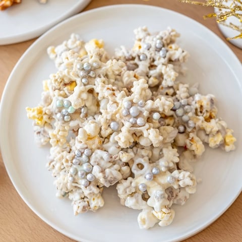 Close-up of Ski Season Snowflake Snack Mix, a sweet and salty winter treat with festive sprinkles.