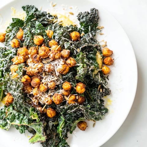 Warm Kale Salad with Crispy Chickpeas, a colorful dish with golden roasted chickpeas ready to eat.