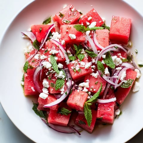 Vibrant Watermelon Feta Salad, showcasing juicy watermelon cubes with creamy feta and fresh mint.