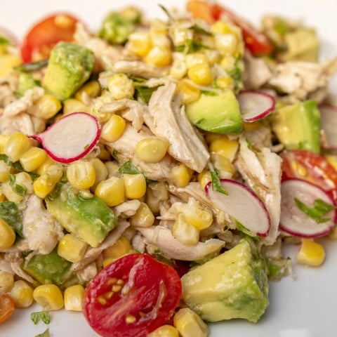 Vibrant Roasted Corn & Chicken Chopped Salad features smoky charred corn and juicy grilled chicken tossed with crisp lettuce.  