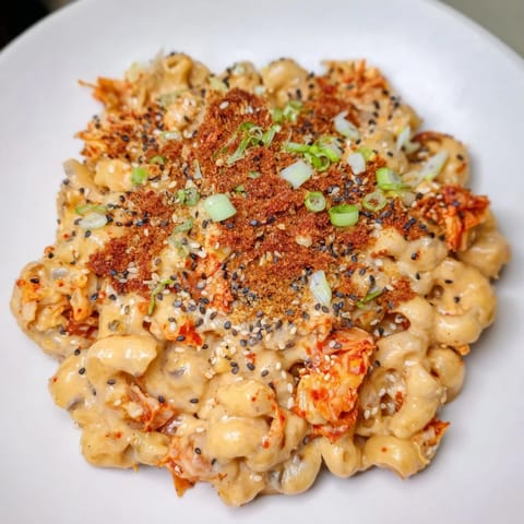 Baked Spicy Kimchi Mac & Cheese overflowing with melted cheese and tangy flavors.  