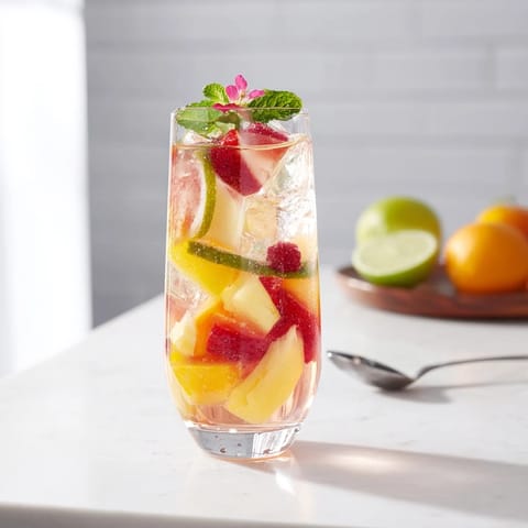 Brightly colored mocktails with strawberry and cucumber, perfect for summer gatherings.  