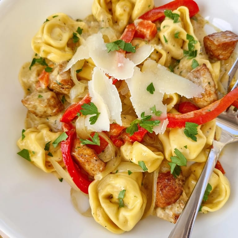 Hearty Zesty Cajun Garlic Parmesan Chicken Tortellini with tender chicken and rich, spicy sauce.