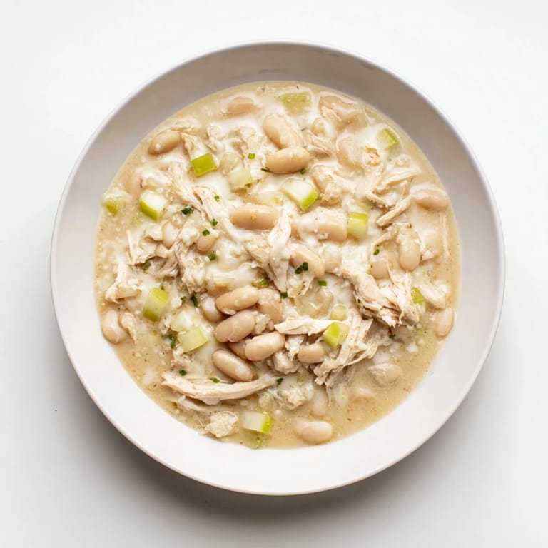 A warm, inviting shot of creamy 35-Minute White Cheddar Apple Chicken Chili, ready to be enjoyed.