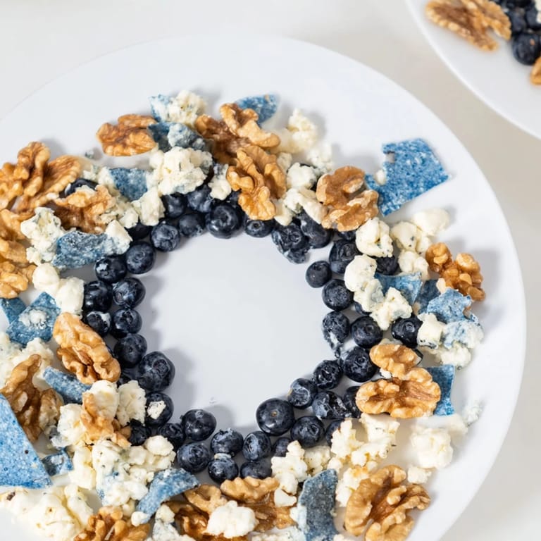 Vibrant arrangement of The Olympic Rings Interlock appetizer, featuring fresh ingredients in interlocking rings on a platter.