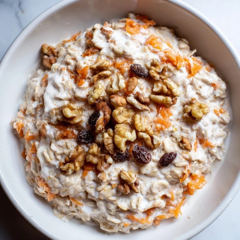 Enjoy a spoonful! This image depicts delicious Carrot Cake Overnight Oats prepared for a healthy meal.