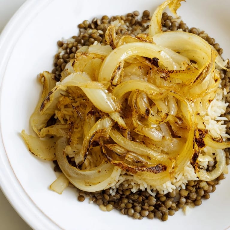 Fragrant, spiced Lebanese Mjadra with fluffy rice and tender lentils, ready to serve alongside a salad.