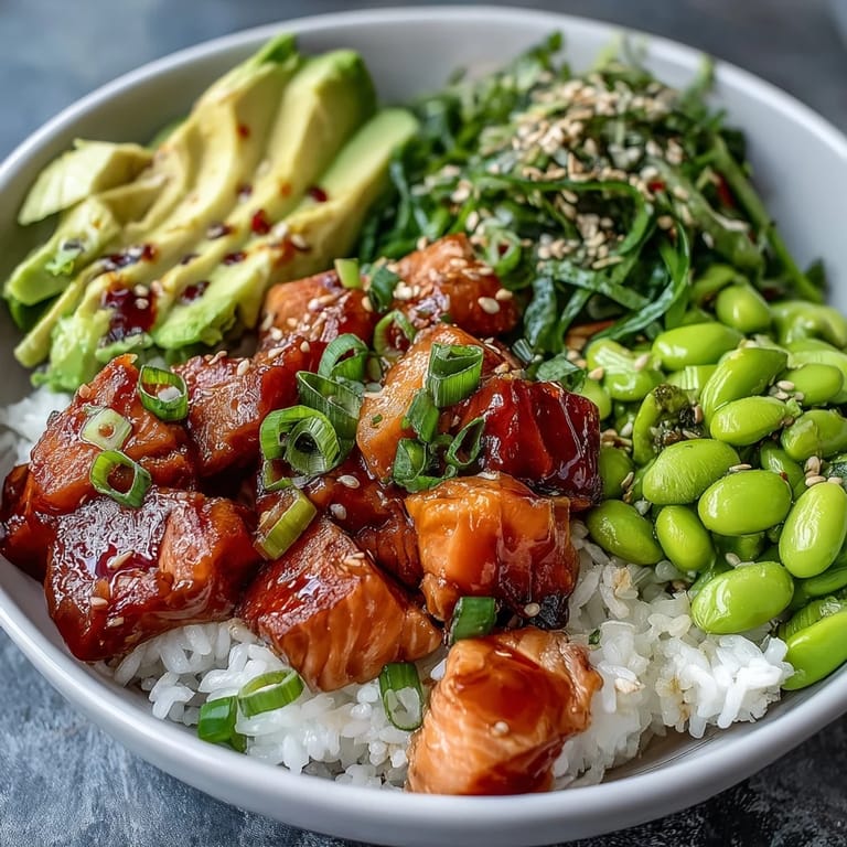 Fresh Salmon Poke Bowl with edamame, avocado, and lime, a beautiful healthy meal concept.