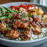 Pineapple Teriyaki Chicken Rice Bowls with juicy chicken, crisp vegetables, and sweet pineapple in savory teriyaki sauce.  