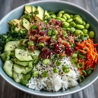Vibrant canned tuna poke bowl layered with fresh vegetables and zesty dressing.