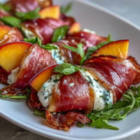 Juicy peach burrata prosciutto salad with creamy burrata and balsamic glaze.